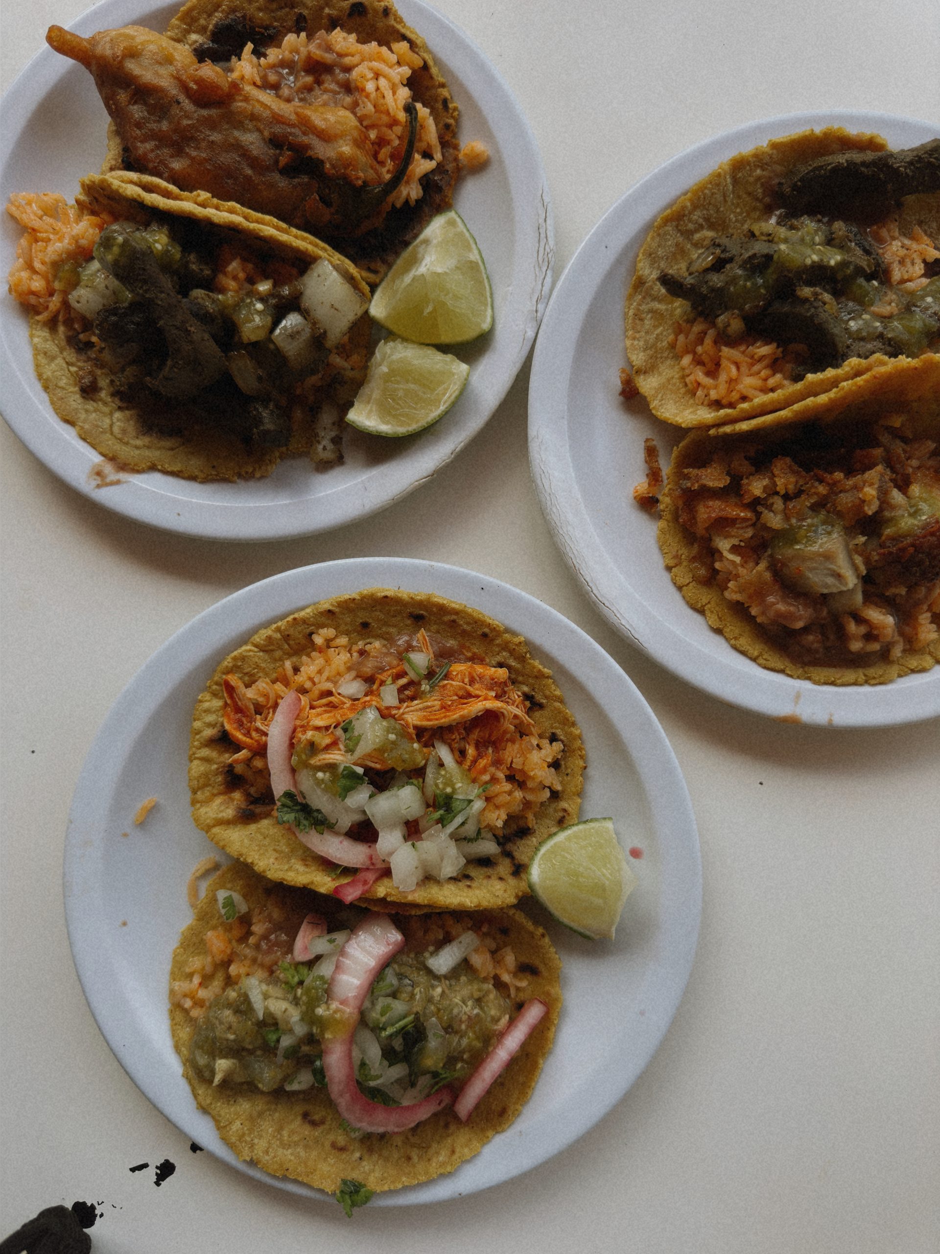 Gourmet tacos with fresh salsa and lime, a refined culinary experience in Tulum.
