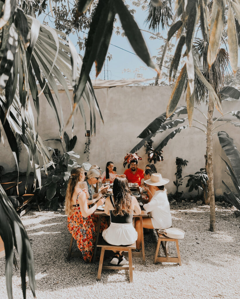 Friends sharing a local meal during a Tulum bachelorette weekend