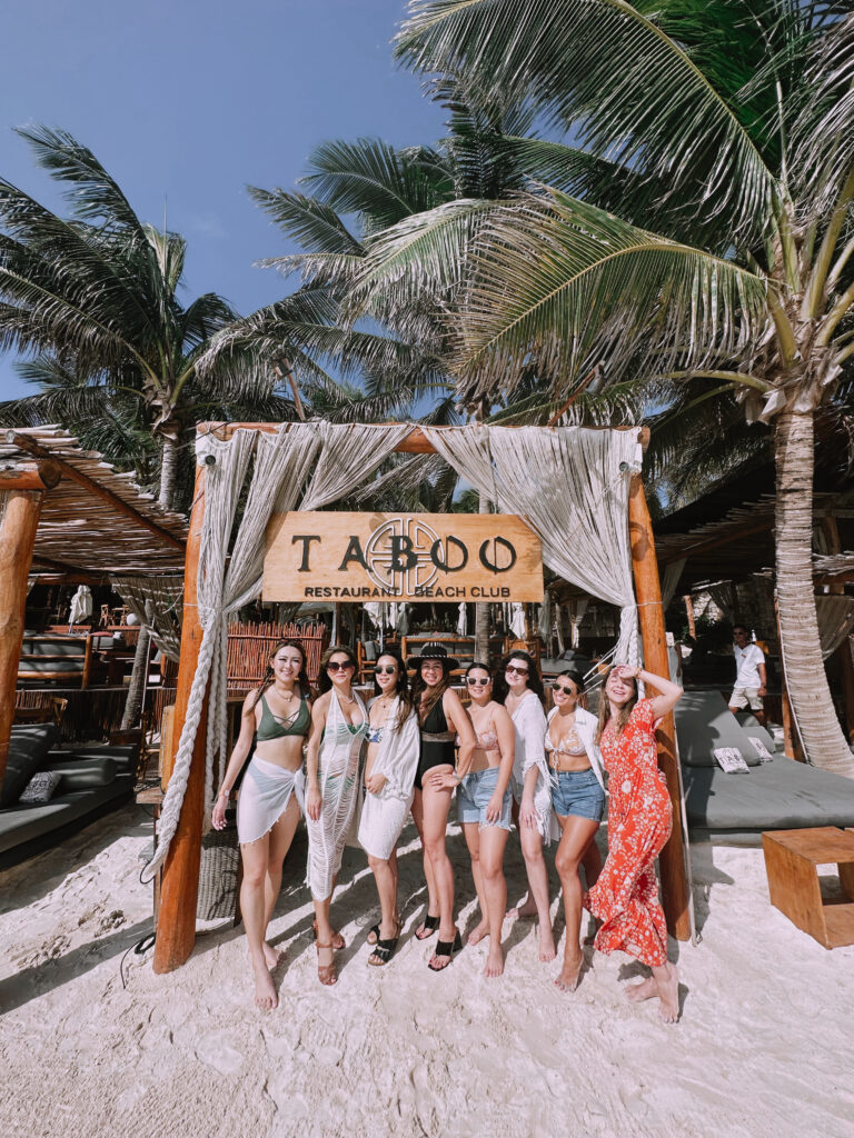 Birthday group spending time together at a Tulum beach club