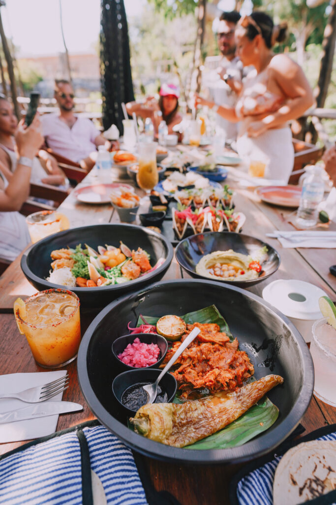 Friends sharing local food during 24 hours in Tulum