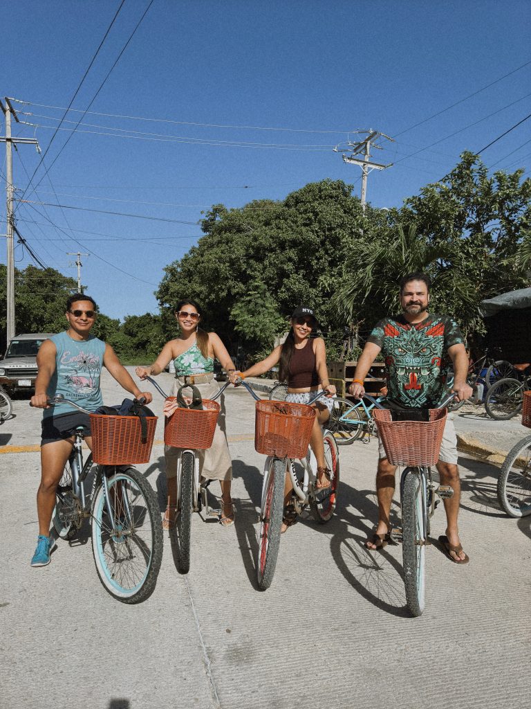 Four friends beginning a private Chemuyil cenote bike tour