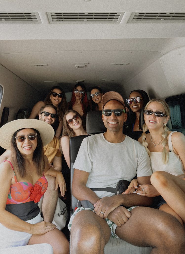 Group enjoying private Tulum transportation in a spacious van, ready for adventure.