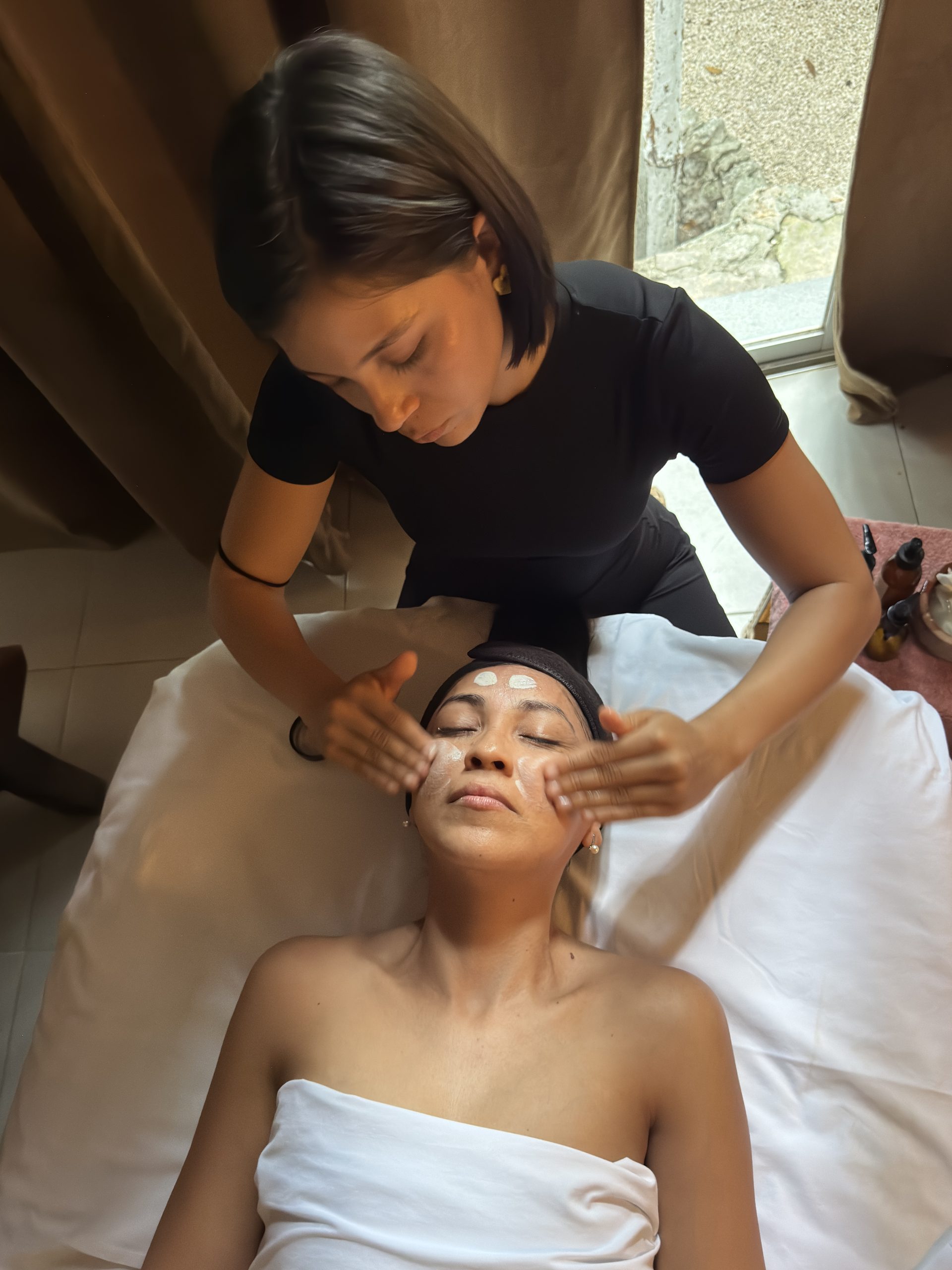 Facial treatment during a private wellness experience in Tulum