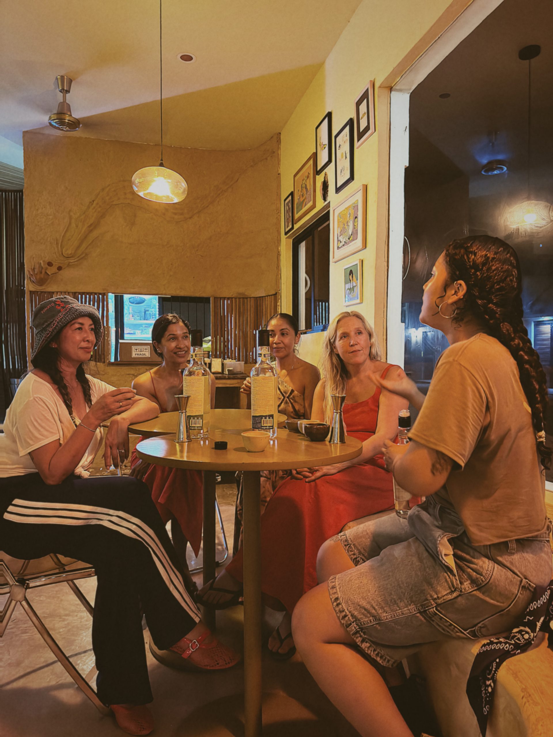 Friends enjoying a private mezcal tasting in Tulum